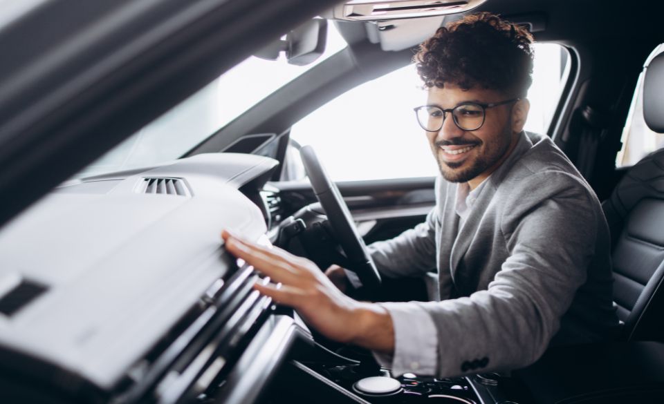 smart man in front of car